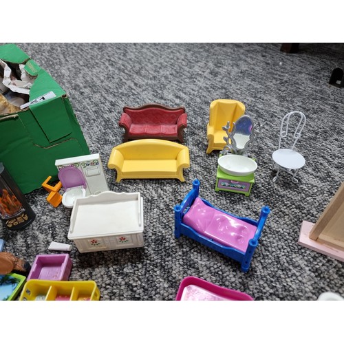 61 - A large collection of dolls house furniture mostly by Playmobil.