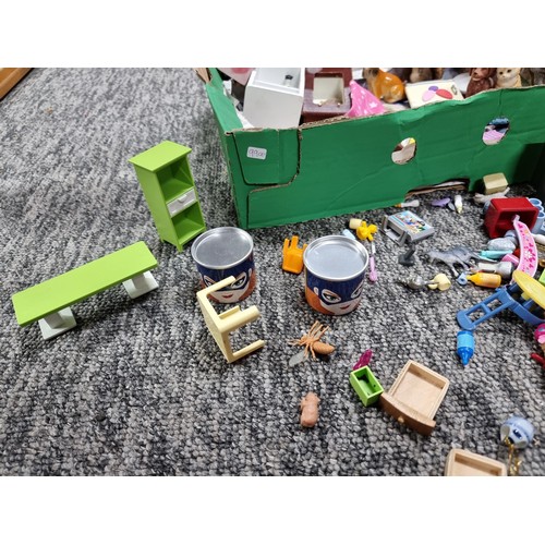 61 - A large collection of dolls house furniture mostly by Playmobil.