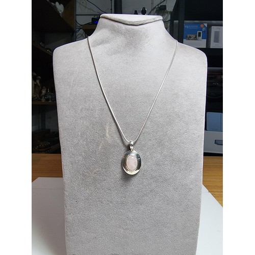 170 - 925 silver pendant with a large rose quartz cabochon stone on 20