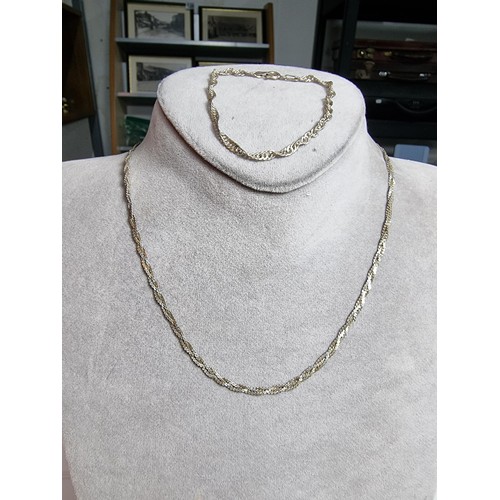 171 - 925 silver three strand neck chain along with a similar 925 silver bracelet. All in good order. Boxe... 