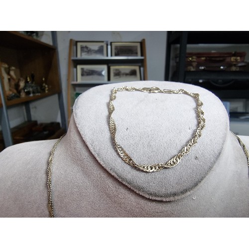 171 - 925 silver three strand neck chain along with a similar 925 silver bracelet. All in good order. Boxe... 