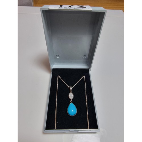 172 - Pretty 925 silver pendant inset with a turquoise stone & CZ crystal stone, on 18