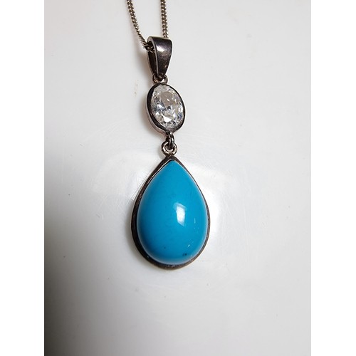 172 - Pretty 925 silver pendant inset with a turquoise stone & CZ crystal stone, on 18