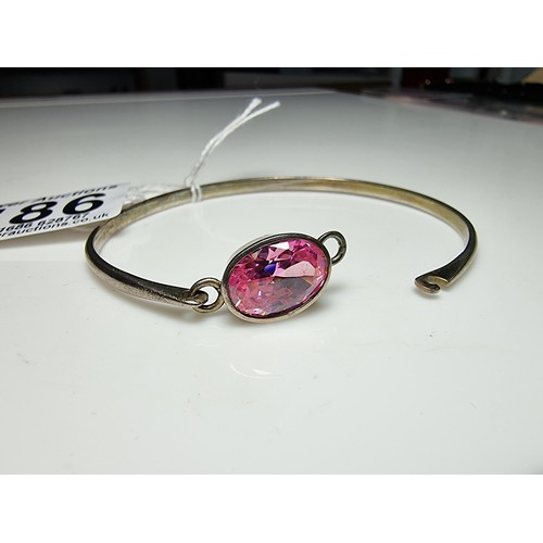 186 - Good 925 silver bangle inset with a large pink oval CZ crystal stone which is sparkly and lively, In... 