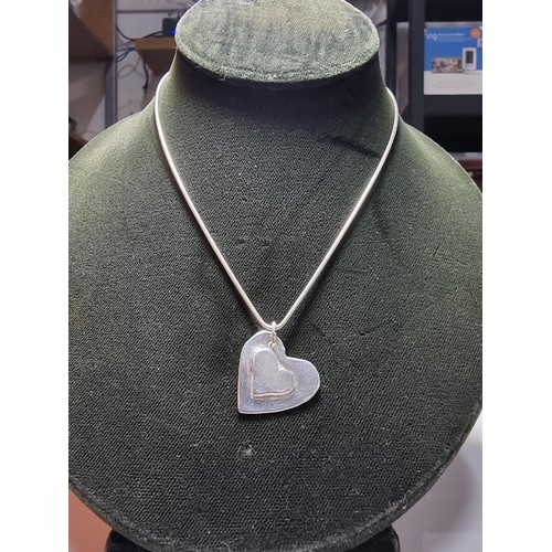 189 - Chunky 925 silver heart pendant set on 18