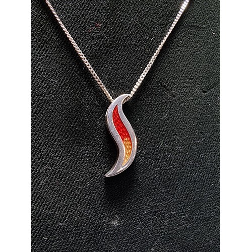 190 - Unusual 925 silver pendant in the form of a flame, with red and yellow enamel inserts. Set on a long... 