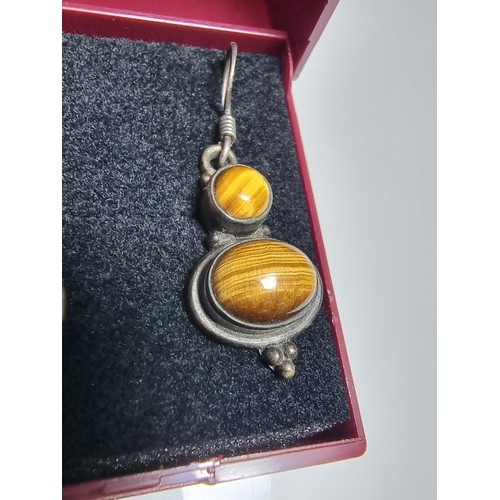 194 - Pair of pretty 925 silver drop earrings inset with Tiger's Eye stones, presenting a good natural col... 