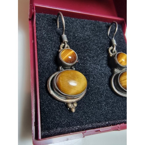 194 - Pair of pretty 925 silver drop earrings inset with Tiger's Eye stones, presenting a good natural col... 