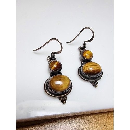 194 - Pair of pretty 925 silver drop earrings inset with Tiger's Eye stones, presenting a good natural col... 