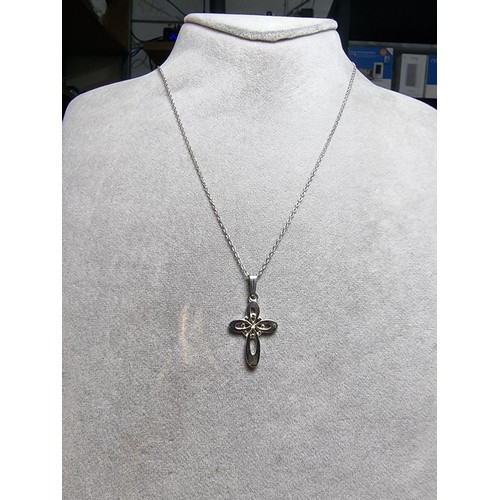 198 - Sterling silver cross pendant on 18