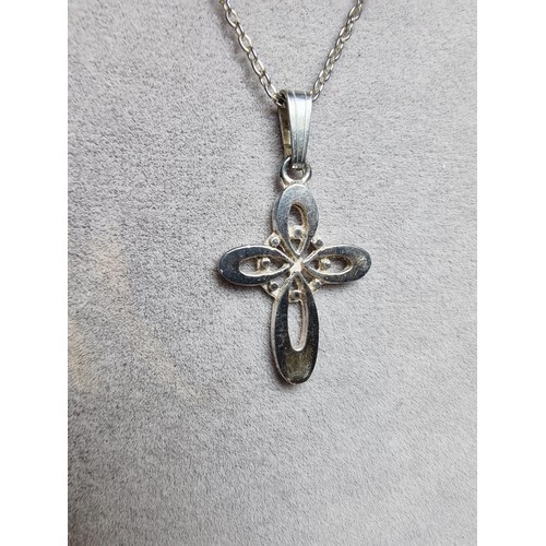 198 - Sterling silver cross pendant on 18