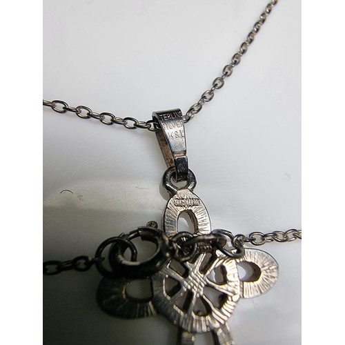 198 - Sterling silver cross pendant on 18