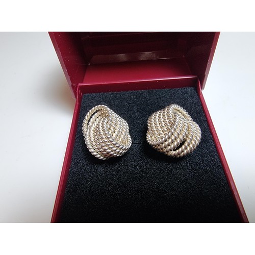 202 - Pair of large 925 silver knot formed stud earrings. In excellent clean condition. Boxed