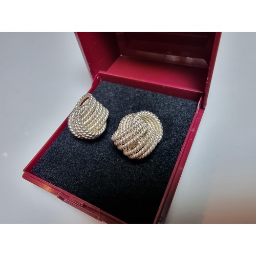 202 - Pair of large 925 silver knot formed stud earrings. In excellent clean condition. Boxed