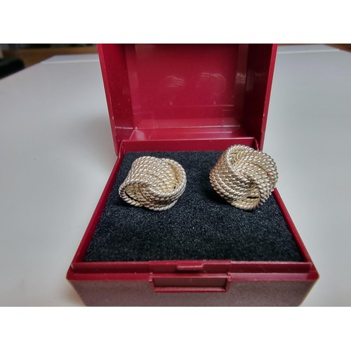 202 - Pair of large 925 silver knot formed stud earrings. In excellent clean condition. Boxed