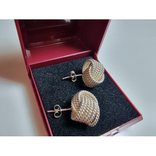 202 - Pair of large 925 silver knot formed stud earrings. In excellent clean condition. Boxed