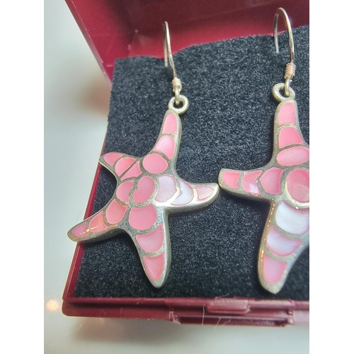 203 - Pair of pretty starfish formed drop earrings inset with pink mother of pearl. In good clean conditio... 