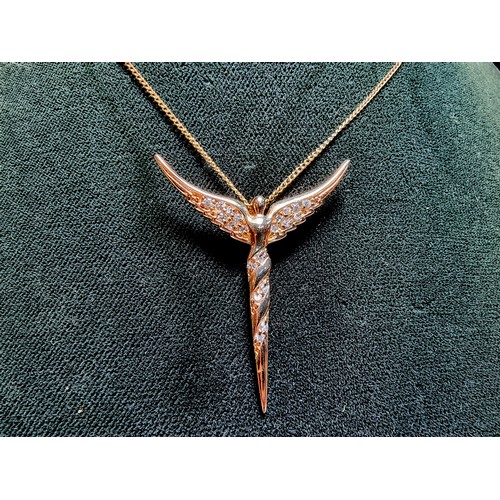 209 - Pretty yellow gold on 925 silver winged angel pendant inset with crystal CZ stones on a 20