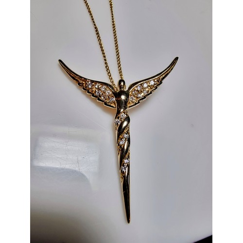 209 - Pretty yellow gold on 925 silver winged angel pendant inset with crystal CZ stones on a 20