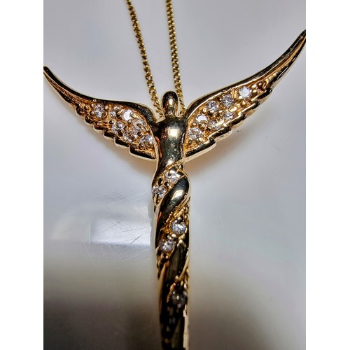 209 - Pretty yellow gold on 925 silver winged angel pendant inset with crystal CZ stones on a 20