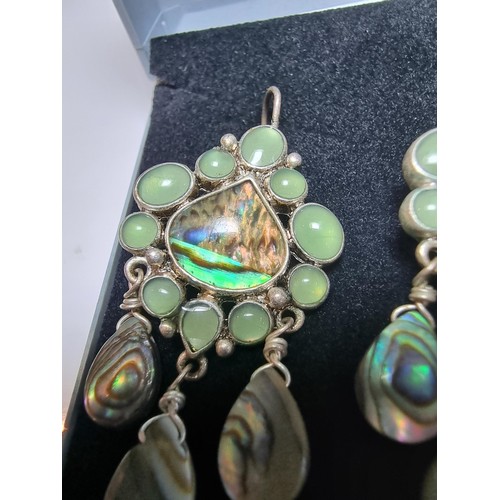 211 - Pair of ornate silver plate on copper drop earrings inset with Abalone shell and green stones, featu... 