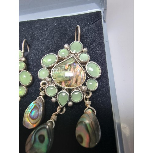 211 - Pair of ornate silver plate on copper drop earrings inset with Abalone shell and green stones, featu... 