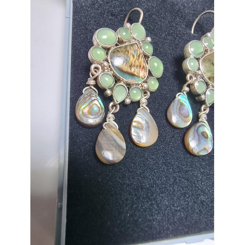 211 - Pair of ornate silver plate on copper drop earrings inset with Abalone shell and green stones, featu... 