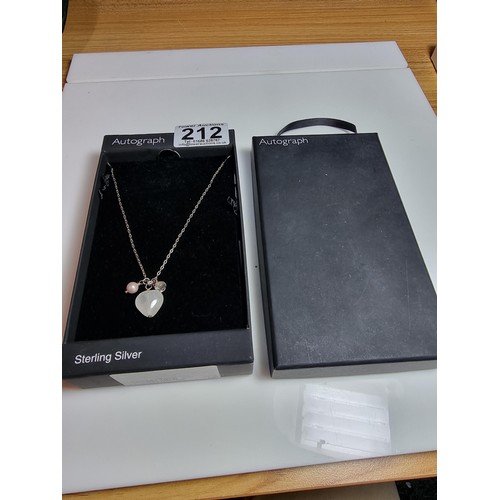 212 - NEXT 925 silver necklace with three charms, in good clean condition, in its original box.