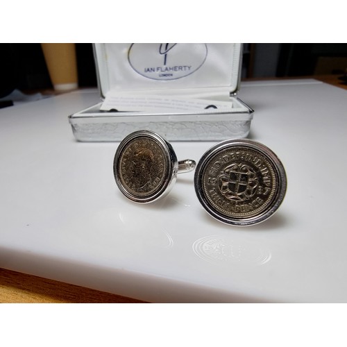 218 - Pair of unused platinum plated pewter cufflinks inset with three pence coins by Ian Flaherty London.