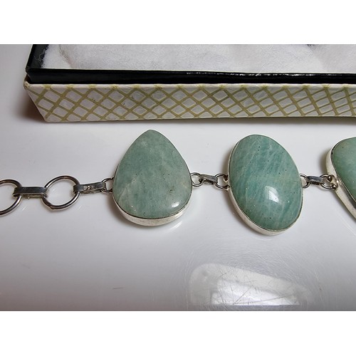 219 - 925 silver bracelet inset with five large polished Amazonite stones in good clean condition. Boxed. ... 