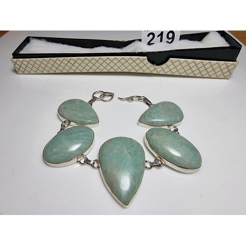 219 - 925 silver bracelet inset with five large polished Amazonite stones in good clean condition. Boxed. ... 