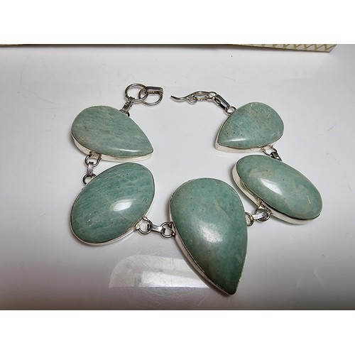 219 - 925 silver bracelet inset with five large polished Amazonite stones in good clean condition. Boxed. ... 