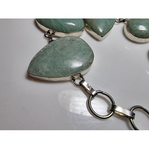 219 - 925 silver bracelet inset with five large polished Amazonite stones in good clean condition. Boxed. ... 