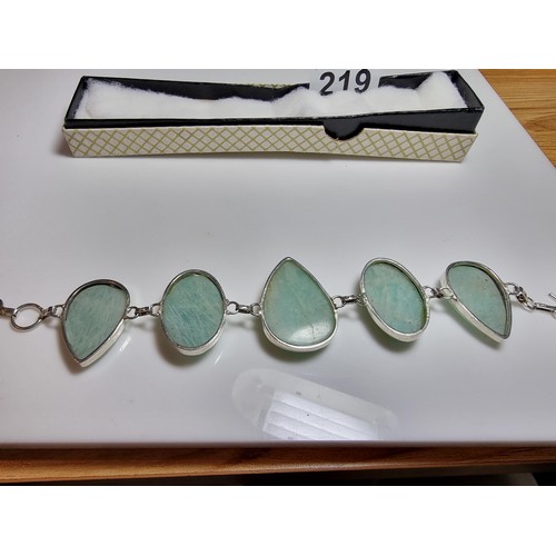 219 - 925 silver bracelet inset with five large polished Amazonite stones in good clean condition. Boxed. ... 