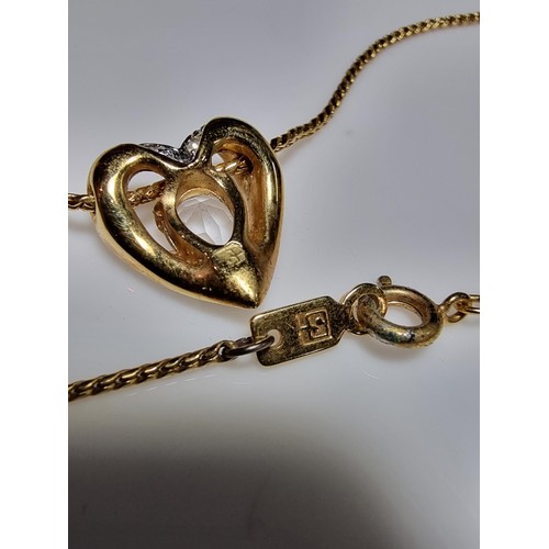 220 - Genuine Swarovski gold plated necklace featuring a heart shaped pendant inset with Swarovski crystal... 