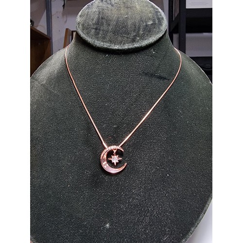 221 - Rose gold plated on solid 925 silver necklace featuring a moon pendant with a dangling star inset wi... 