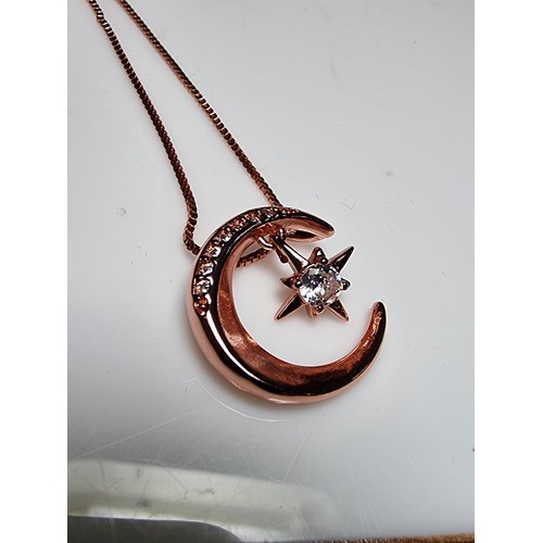 221 - Rose gold plated on solid 925 silver necklace featuring a moon pendant with a dangling star inset wi... 