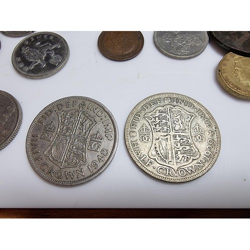 252 - Collection of various British coins to include a silver 1929 half crown coin, £5 pound coin, £1 note... 