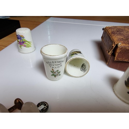 253 - Small qty of collectables to include 8x Royal Worcester thimbles, 4x pairs of cufflinks, pin badges,... 