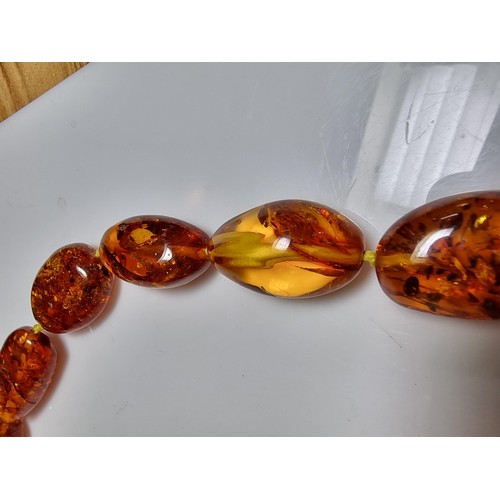 259 - Large vintage chunky natural Baltic amber beaded necklace with inclusions, hand knotted, presenting ... 