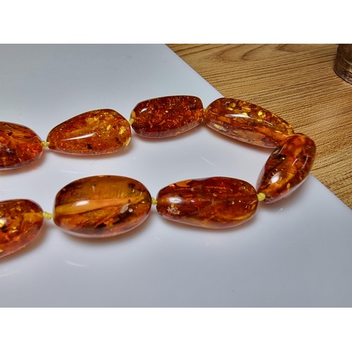 259 - Large vintage chunky natural Baltic amber beaded necklace with inclusions, hand knotted, presenting ... 