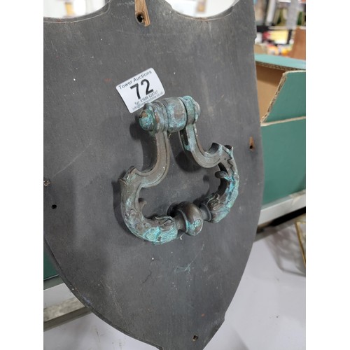 72 - A box of general items including an antique verdigris copper door knocker on wooden shield and an an... 