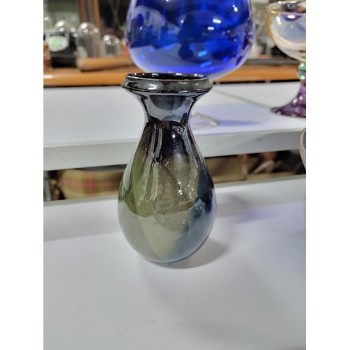 77 - Quantity of collectables inc a large colbolt blue brandy glass formed vase, red glass vase, collecti... 