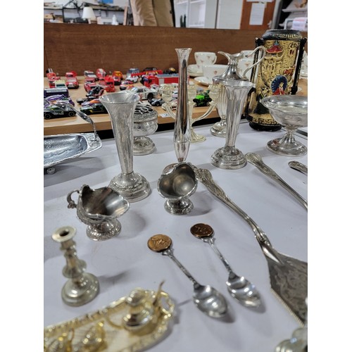 91 - Large quantity of plated ware inc a 4 person egg cup set with spoons, bud vases, cake knifes, sugar ... 