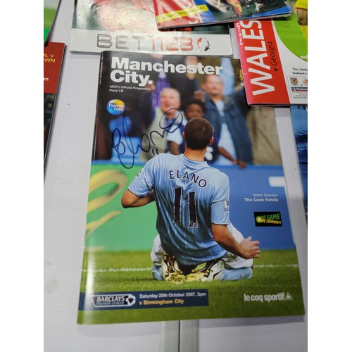 95 - A large quantity of football programmes for different clubs and internationals inc one signed by cov... 