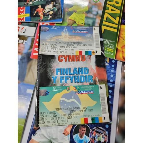 95 - A large quantity of football programmes for different clubs and internationals inc one signed by cov... 