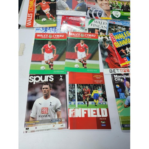 95 - A large quantity of football programmes for different clubs and internationals inc one signed by cov... 