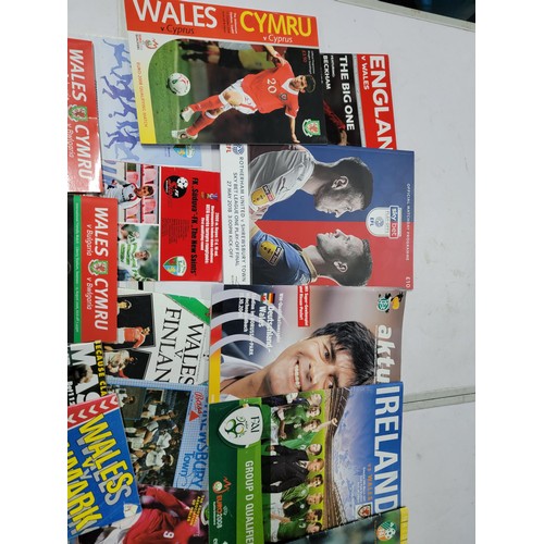 95 - A large quantity of football programmes for different clubs and internationals inc one signed by cov... 