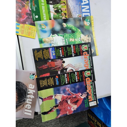 95 - A large quantity of football programmes for different clubs and internationals inc one signed by cov... 