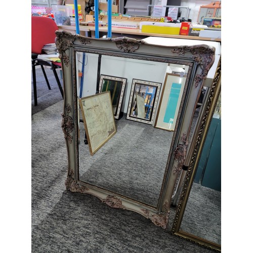 106 - 2x gilt framed bevel edged mirrors in good order largest measures 122cm high 36cm wide